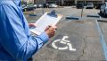 Contractor reviewing a Third-Party CASp accessibility report for ADA construction planning