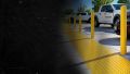 ADA design-build remediation team measuring an accessible route at a California commercial property