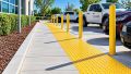 ADA design-build remediation team measuring an accessible route at a California commercial property